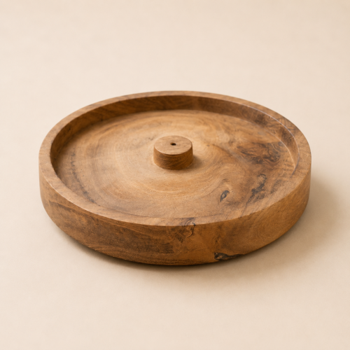 MOCCALO round wooden incense holder with a recessed surface on a cream background