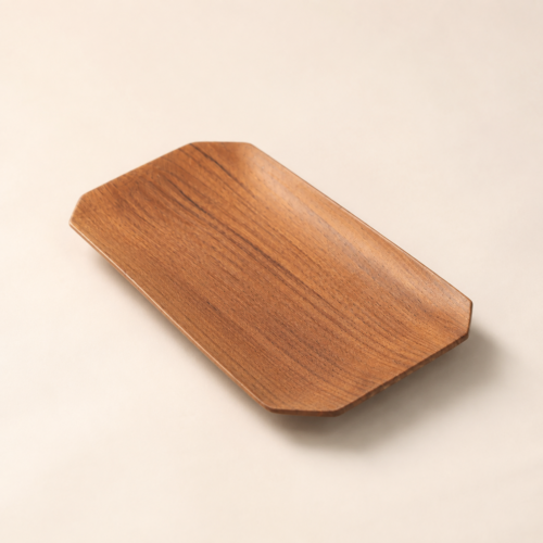 MOCCALO wooden amenity tray with clipped corners, curved edges, and visible grain on a cream background