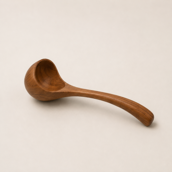 MOC-KT-UTS-L MOCCALO large wooden serving spoon on a cream background